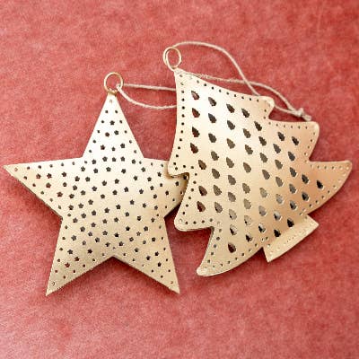 Star-shaped gold ornaments with cut-out patterns on a red background